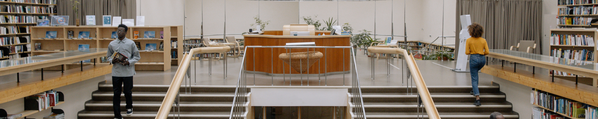 panaromic view of two people transversing stairs